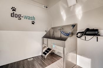 A dog wash station with a sign on the wall.